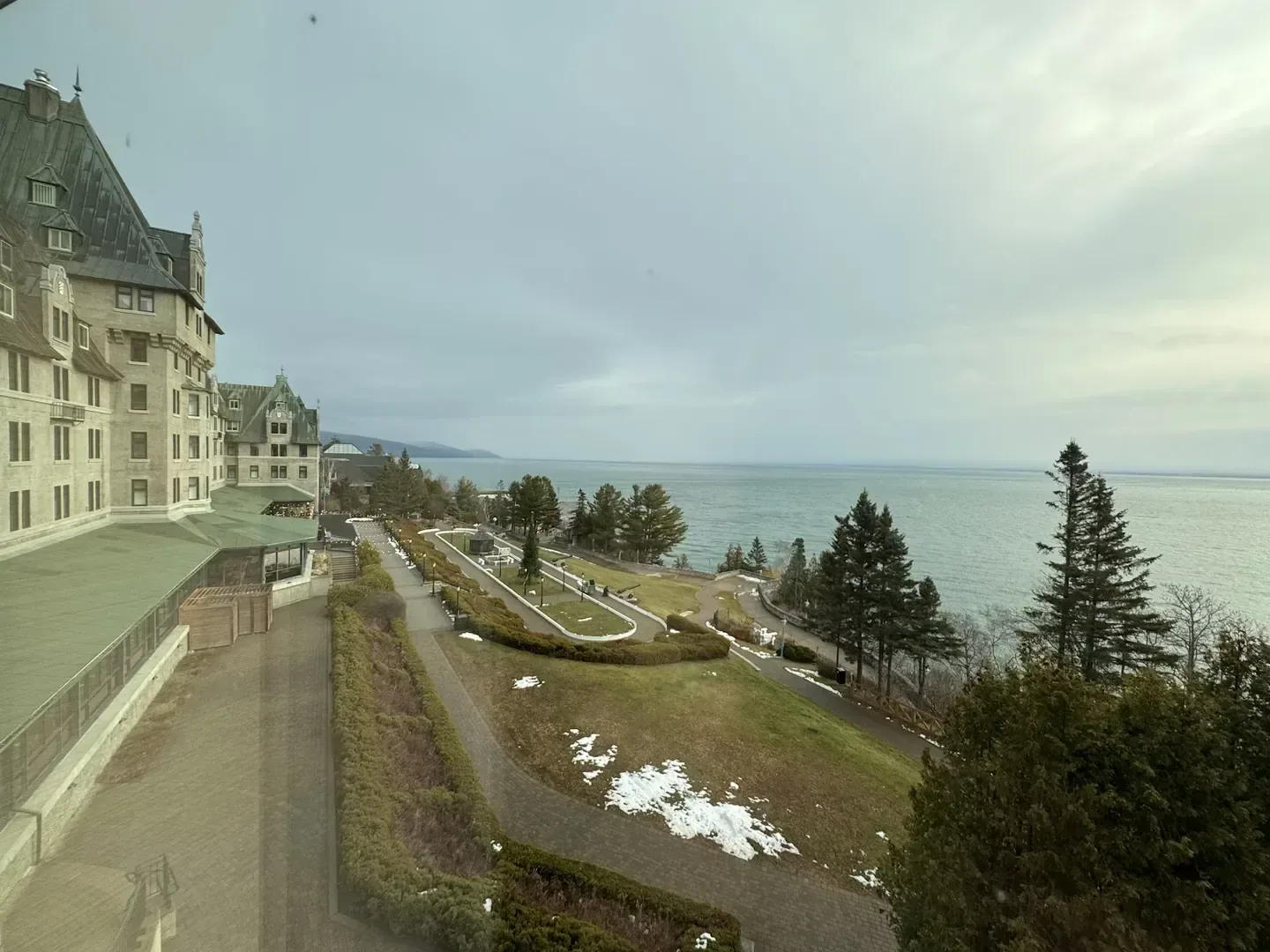 Historic resort façade facing a shoreline landscape